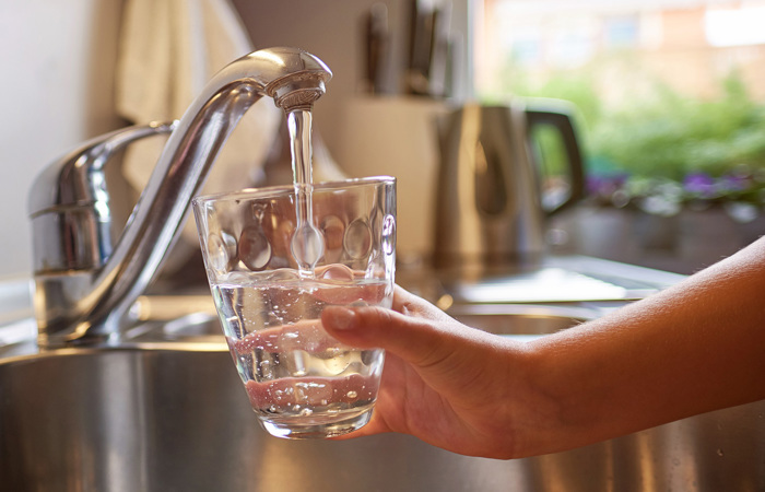 Filling a glass with water