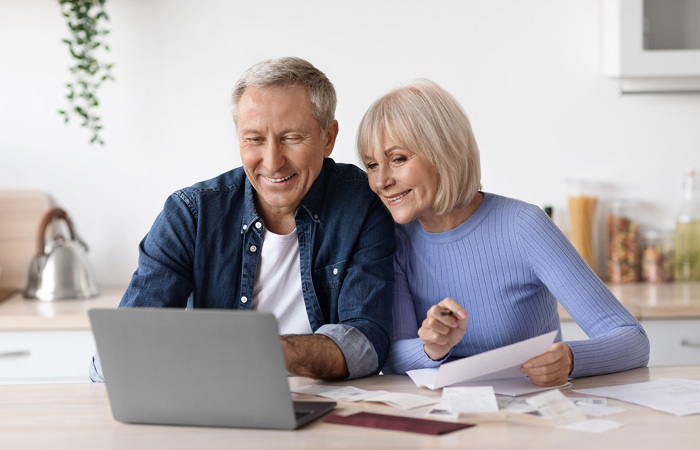 Two people looking at a computer