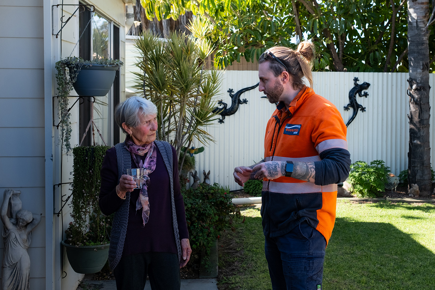 Two people talking outside