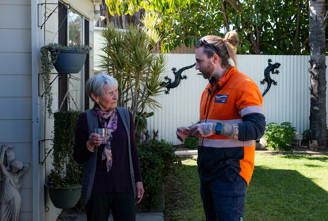 Two people talking outside